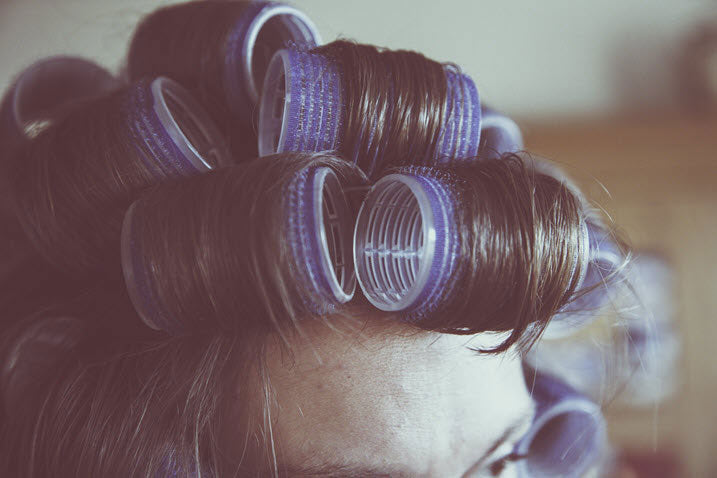 lady using rollers before going to sleep