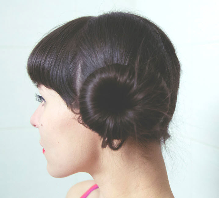 girl getting a hair bun before sleeping