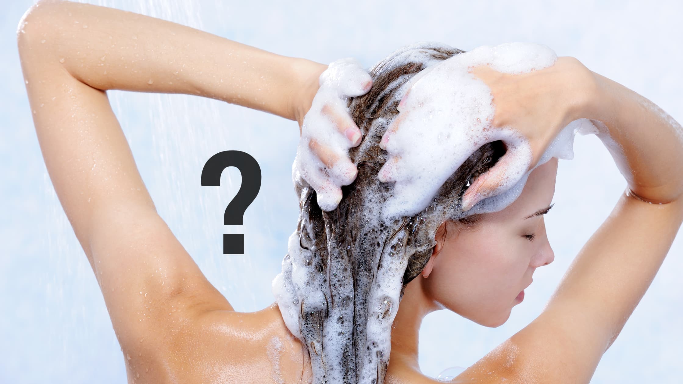 lady using a shampoo to clean her hair