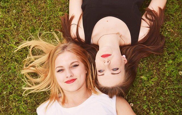 Two girls lying on the ground