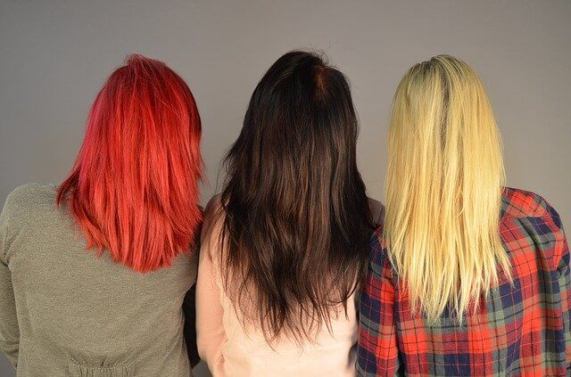 models wearing colored hair extensions