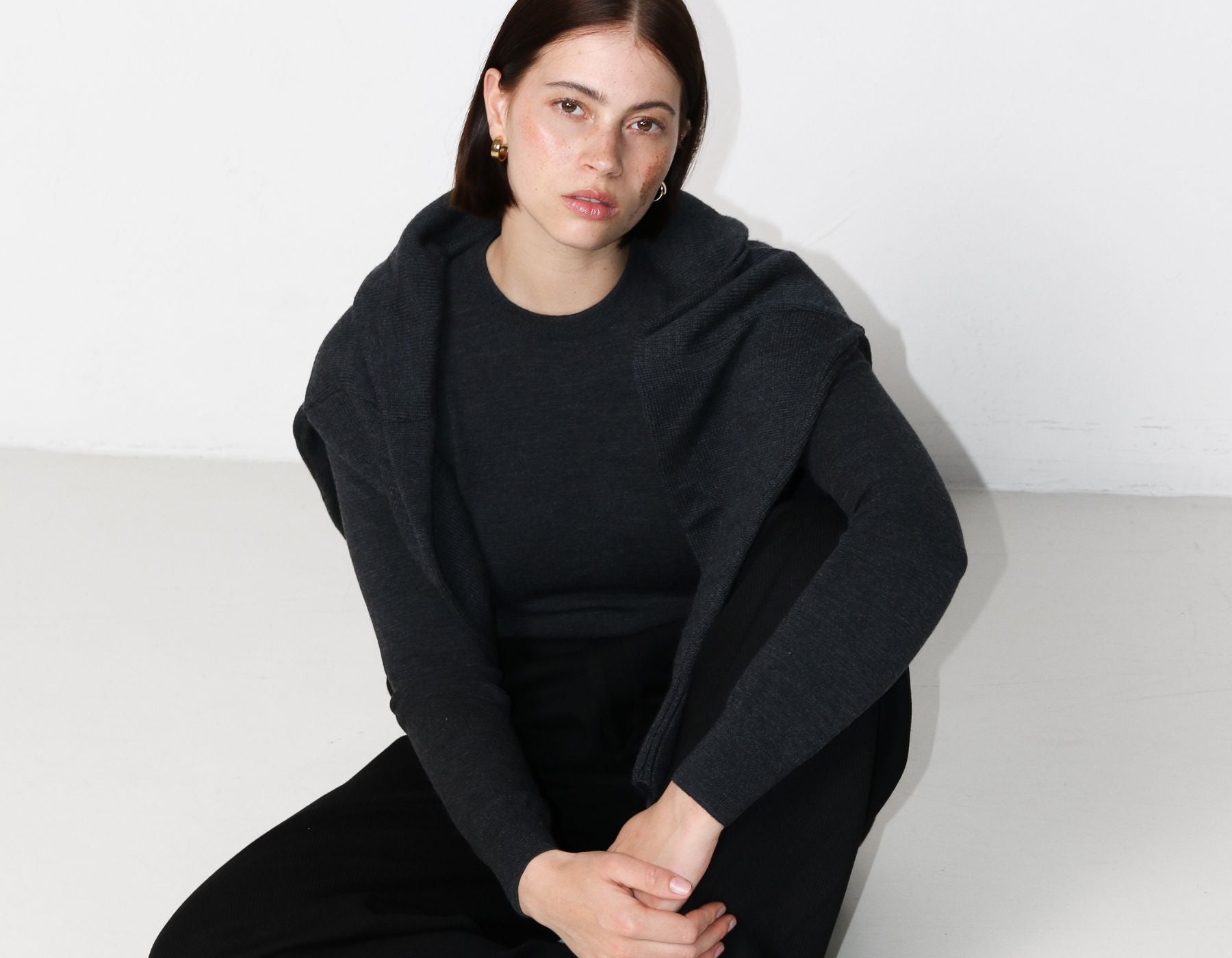 Woman wearing Rhea merino wool knits