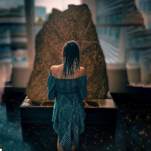 Elin Pirsos picture of her standing in front of a runestone on display