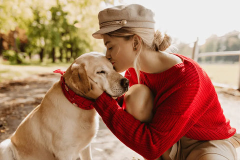 girl kissing a dog, girl fostering a dog