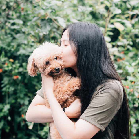 happy woman with the happy white dog