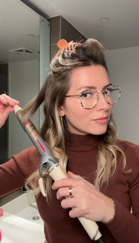 Blogger using infrared curling iron