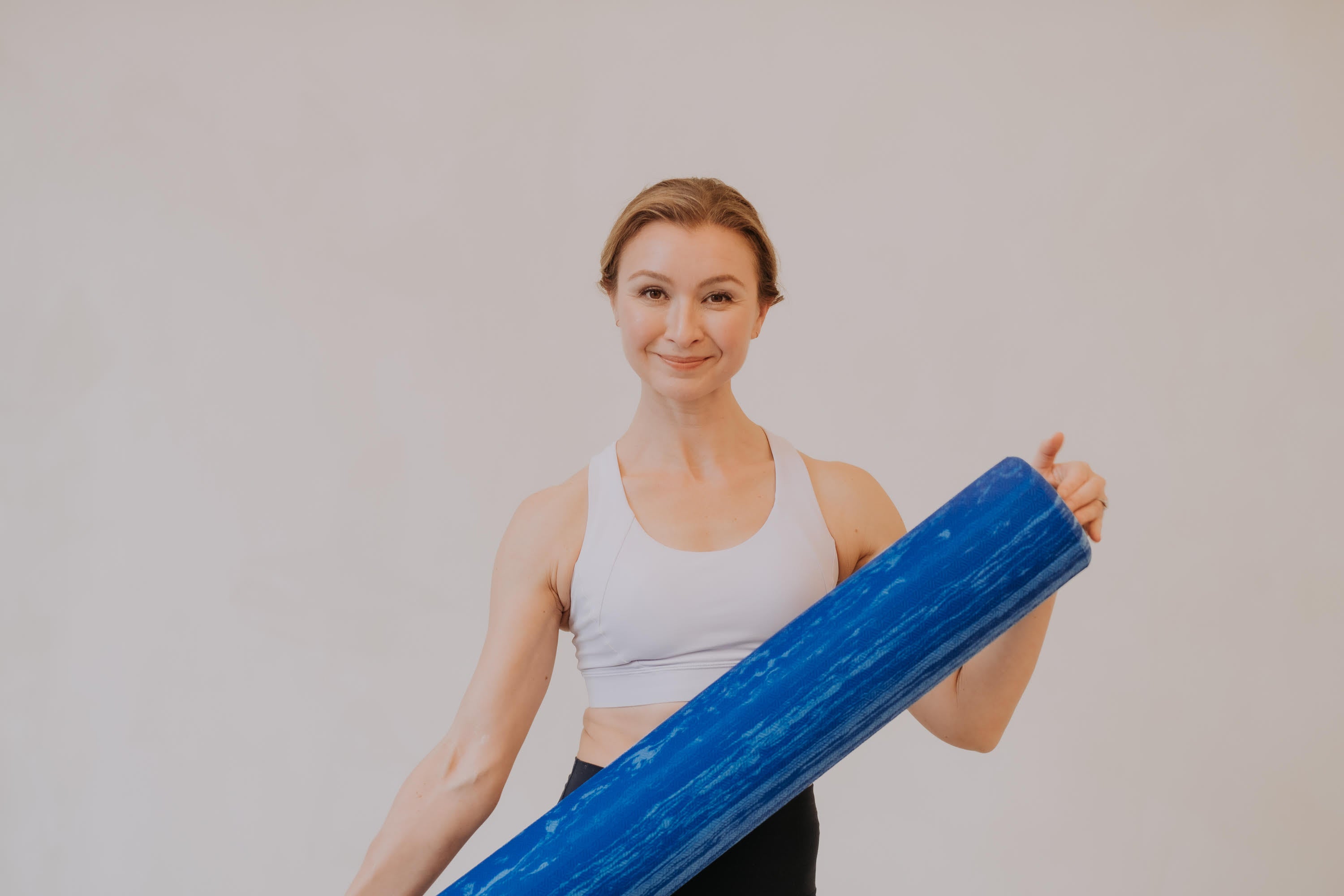 Image of Rachel Welch holding a yoga mat