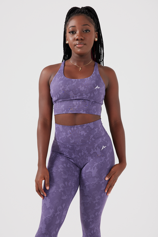 Girl wearing purple legacy scrunch bum leggings and sports bra, front