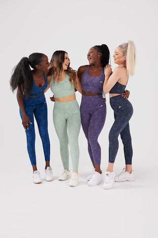 four girls posing in camouflage activewear set