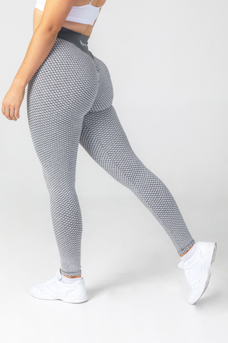 Close up girl wearing grey luna scrunch bum seamless leggings, back 