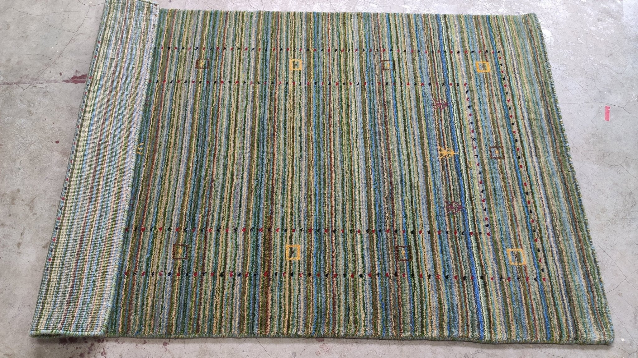 https://cdn.shopify.com/s/files/1/0257/9169/2836/products/3x49-green-handwoven-gabbeh-rug-848238.jpg?v=1692008699