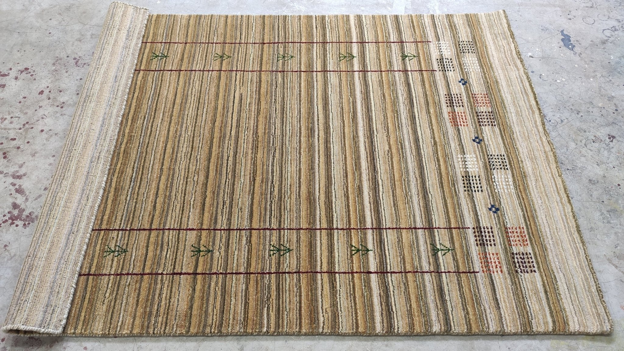 https://cdn.shopify.com/s/files/1/0257/9169/2836/products/4x59-beige-handwoven-gabbeh-rug-575047.jpg?v=1692008704