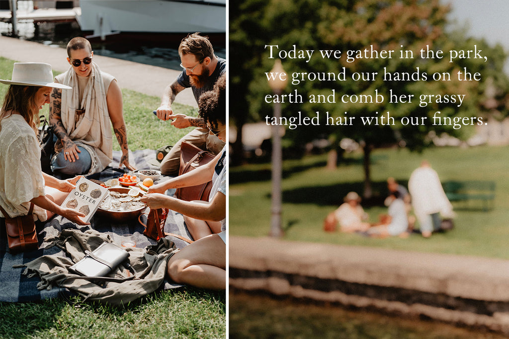 Friends eating a picnic at the park with oysters and leather products by The Local Branch