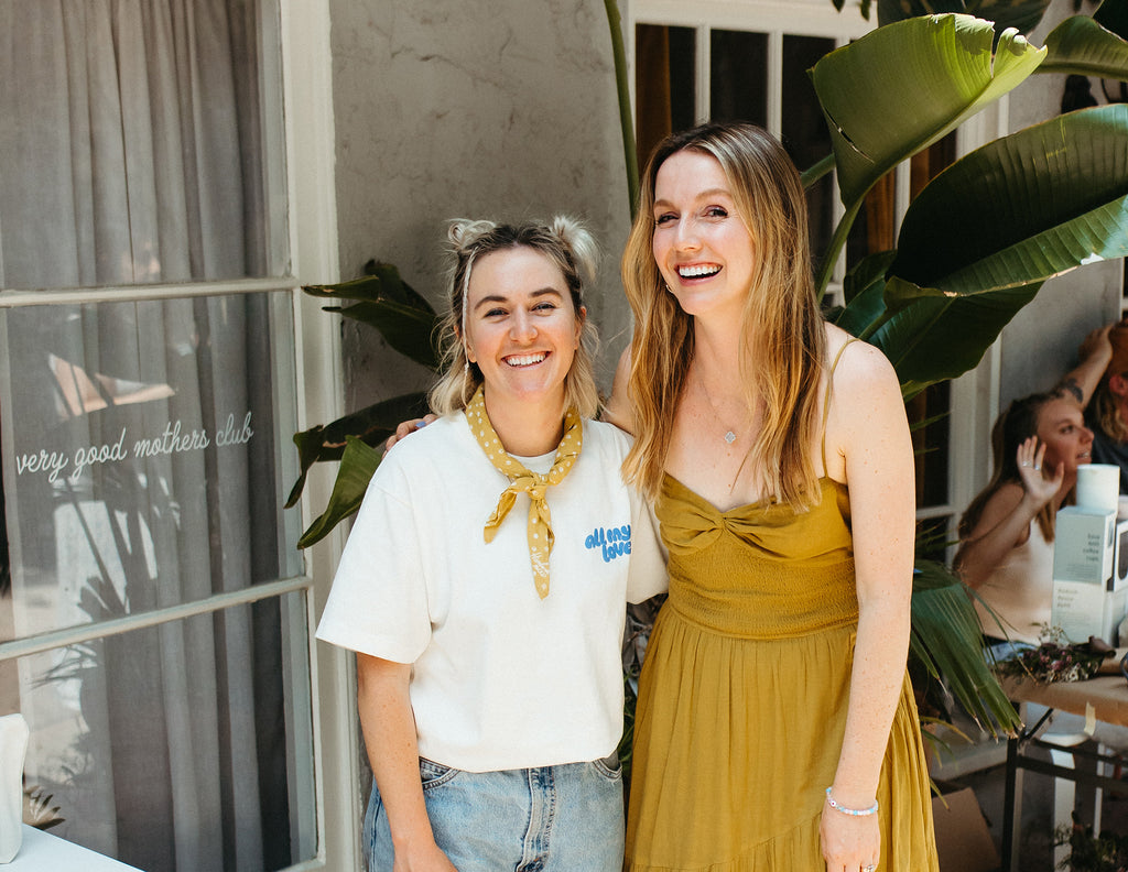 Becca and Jess standing in front of the Very Good Mothers Club Shop