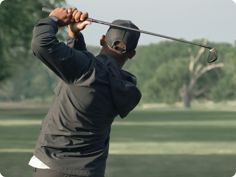 Golfer driving a ball