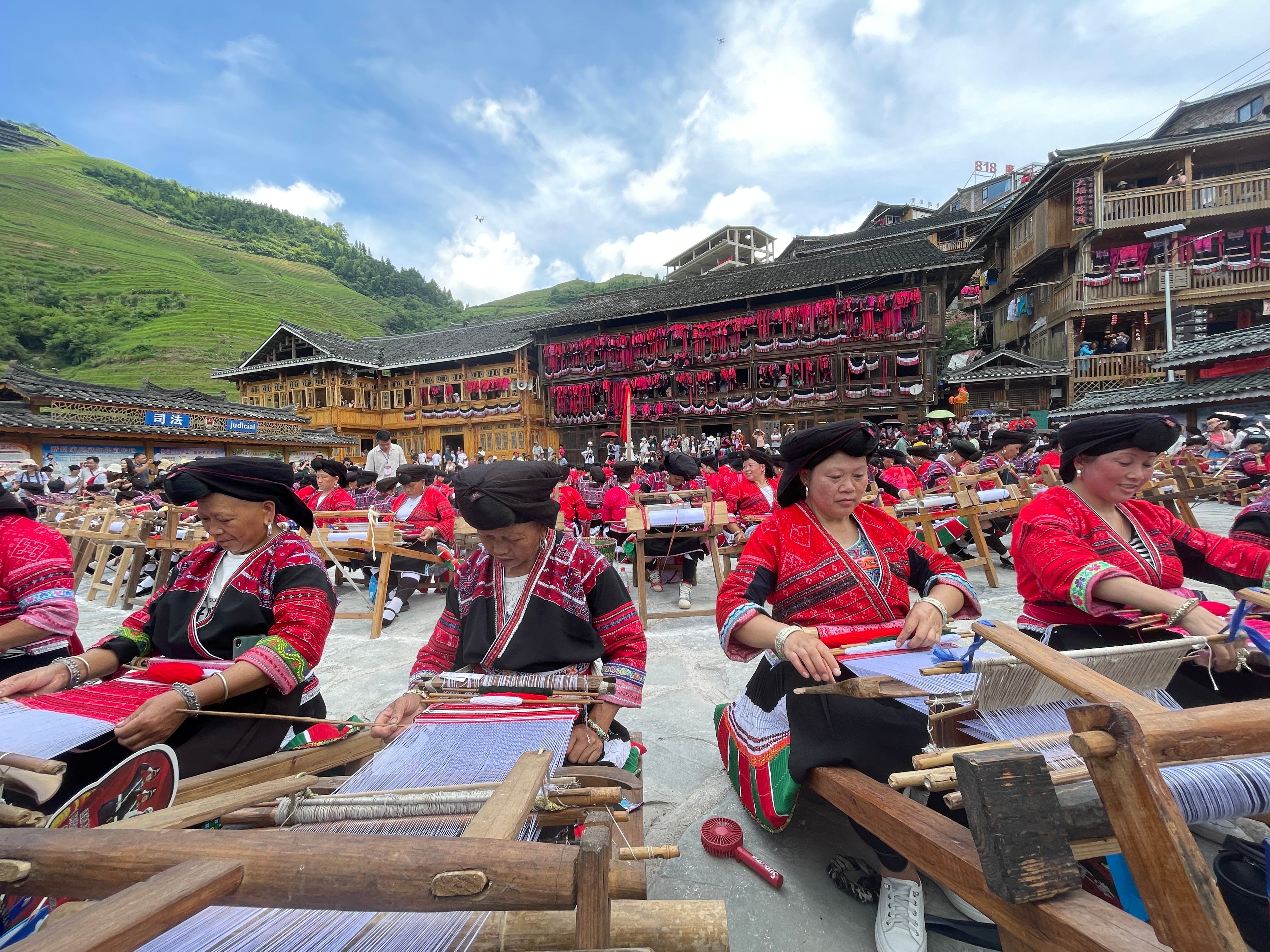 Red Yao sewing and weaving demonstration at the annual 'Clothes Hanging' festival.