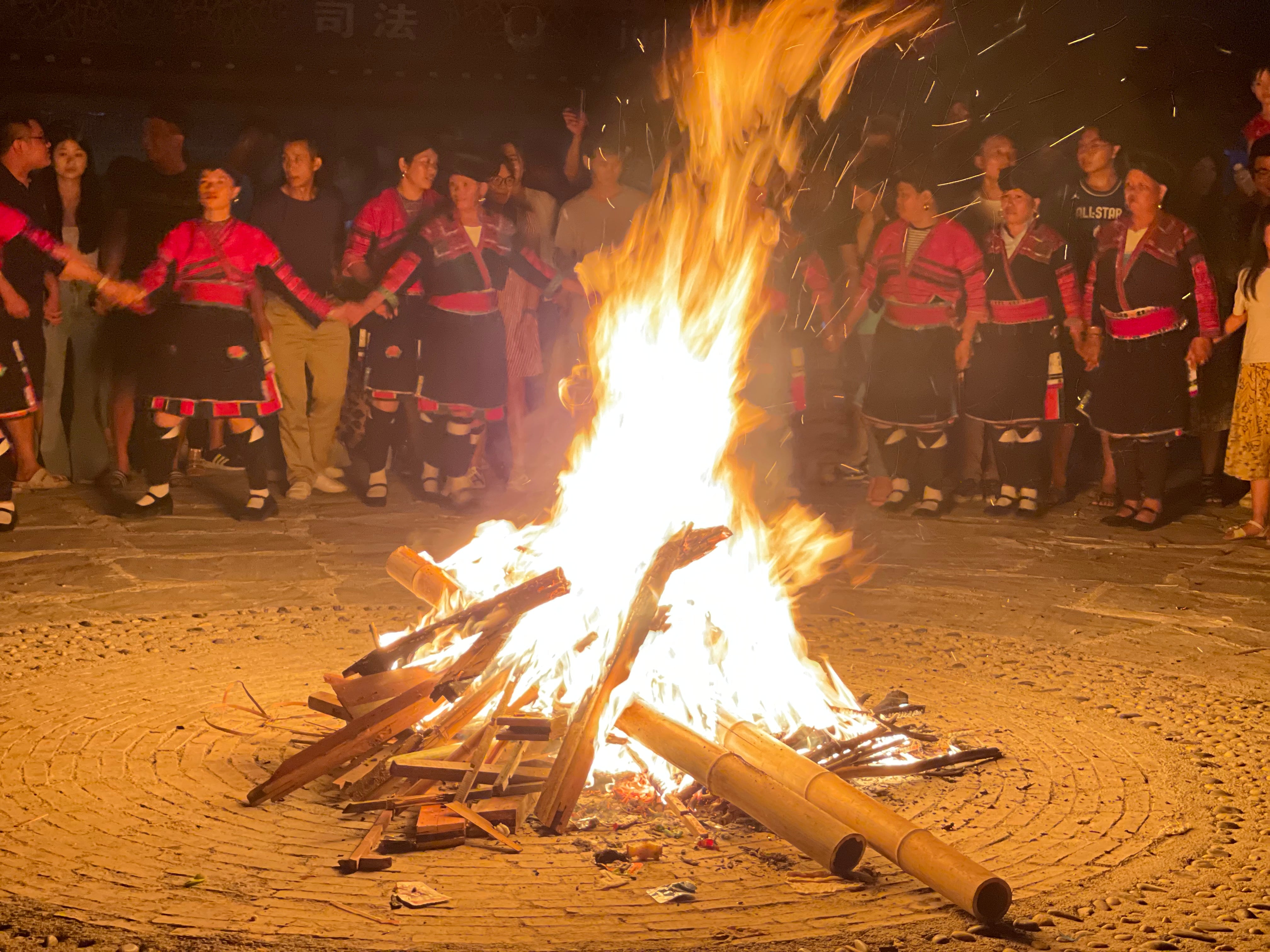 Campfire and dancing at the annual 'Clothes Hanging' festival.