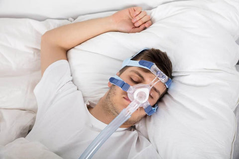 sleeping man with CPAP Mask