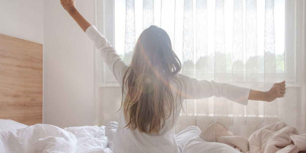 women sitting up in bed