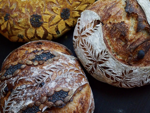 Picture of scoring on sourdough country loaves