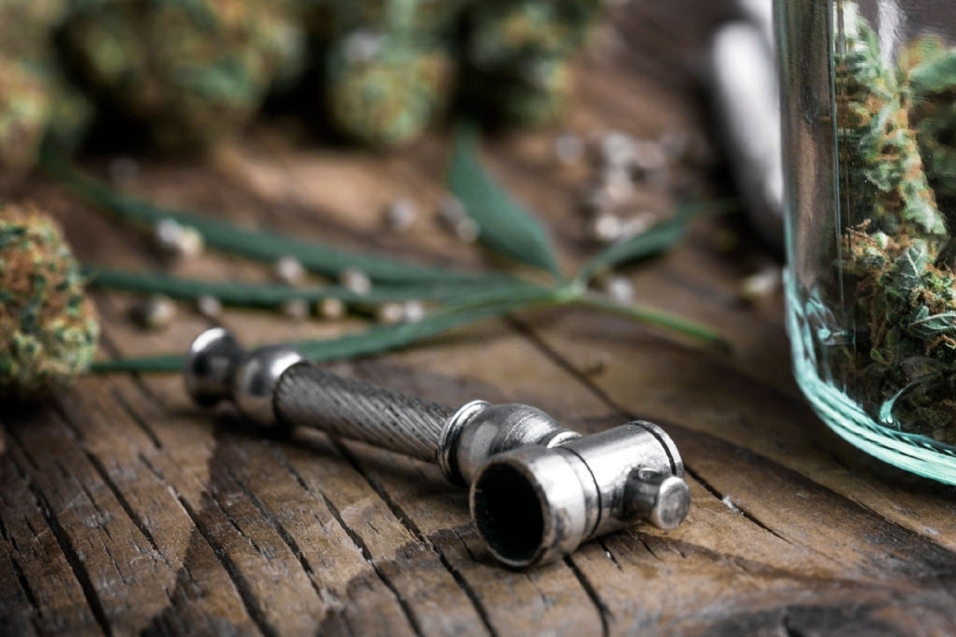 Premium Photo  Vertical shot of bong and pipe filled with weed set of  accessories for smoking cannabis marijuana