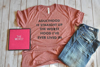 Soft unisex shirt with adulthood is the worst hood design. Find more fun sarcastic tees at www.blndesigns.com