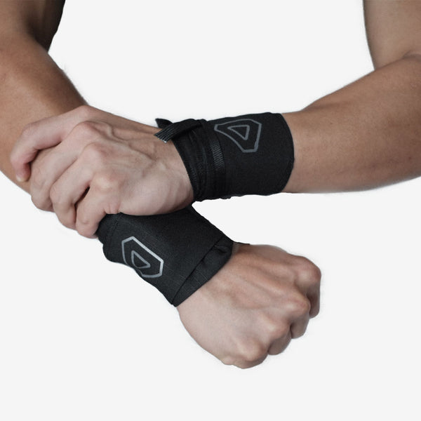 Arms with grav wrist wraps holding together
