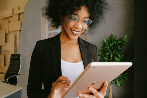 woman looking at a tablet