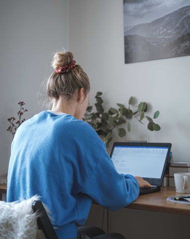 woman working from home on laptop staying productive