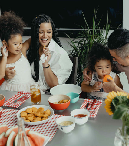 family having lunch together at the table