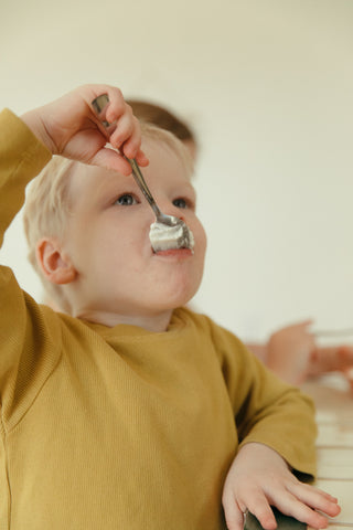 One boy eating chocolate mousse