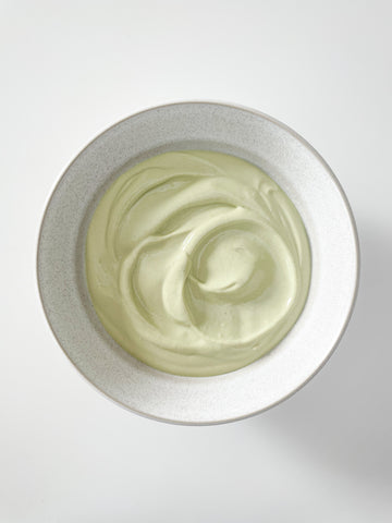 matcha, vanilla, and yogurt mixed together in bowl