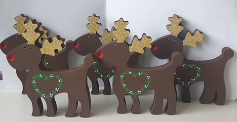 Five hand painted freestanding reindeer with red noses 