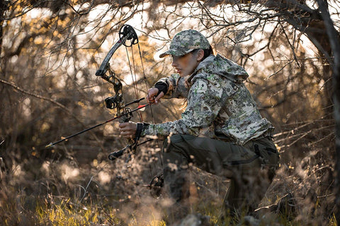 woman hunting turkeys in the rain