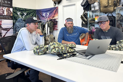 Willie Robertson and Andy Techmanski meeting with worker at FORLOH factory