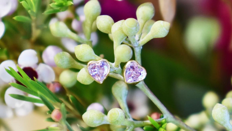 heart-shaped earrings in white gold set with a pink tourmaline
