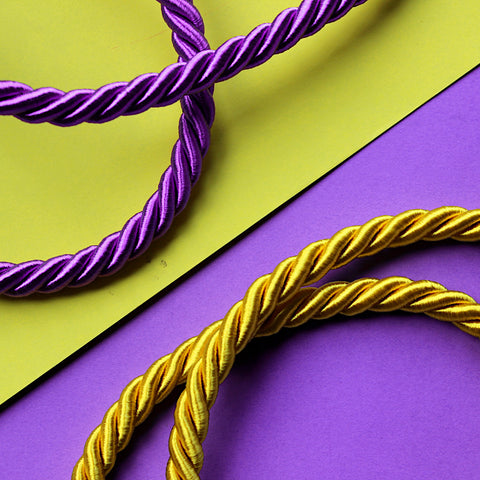 A close-up image of twisted cord on a contrasting background