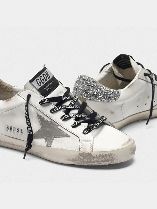 superstar sneakers with silver sparkle foxing and metal stud lettering