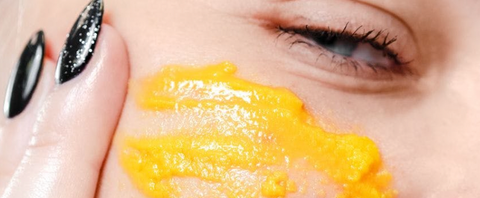 Yellow oil cleanser rubbed under the eye with two fingers. Tres Keikis Natural Skincare