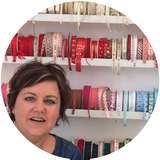 Ruth Caig with a display of ribbons
