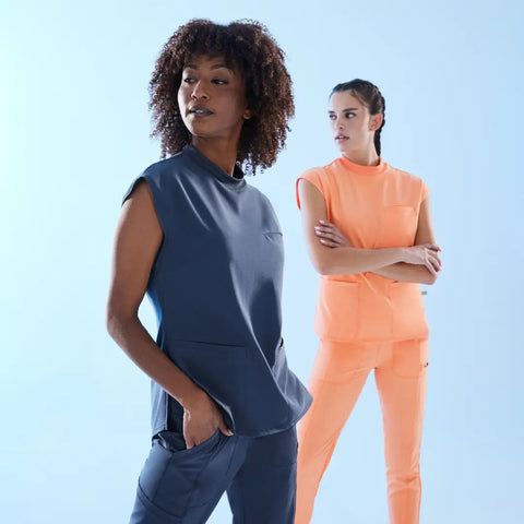 Nurse and CNA wearing contemporary fit scrubs.
