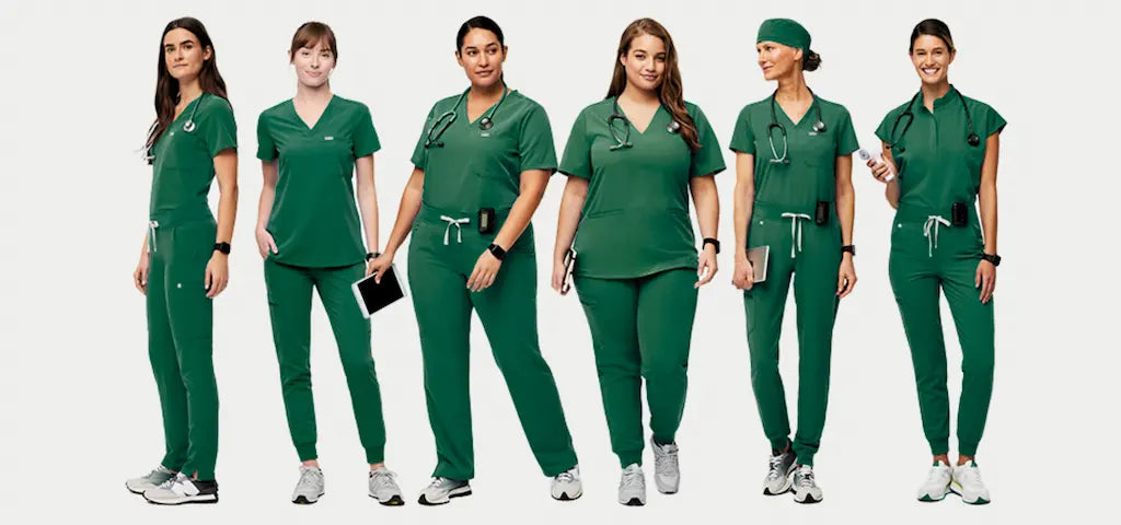 A group of female surgeons wearing Hunter Green scrub uniforms on a white background.