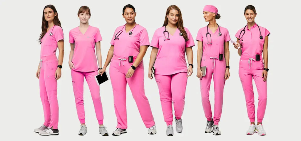 A group of female Oncology Nurses wearing light pink medical uniforms on a white background.
