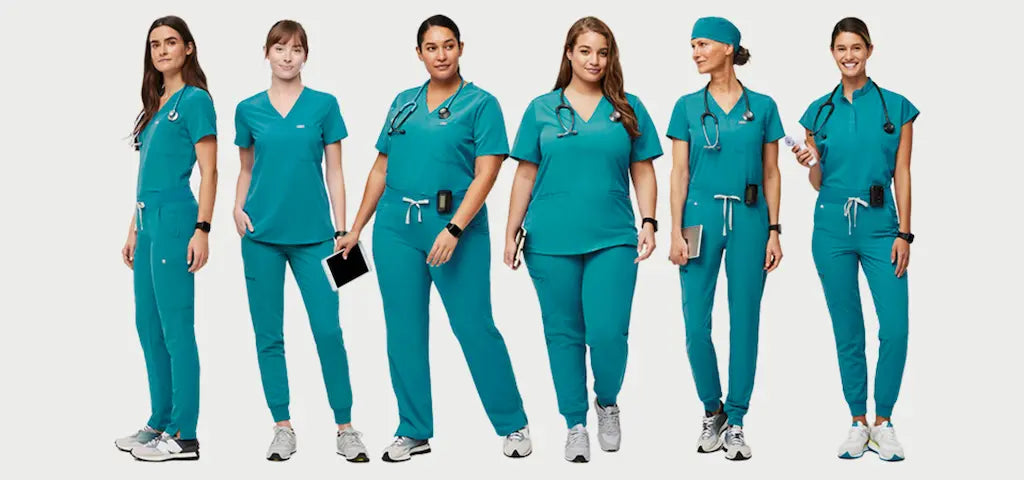 A group of female surgeons wearing teal blue scrub uniforms on a white background.