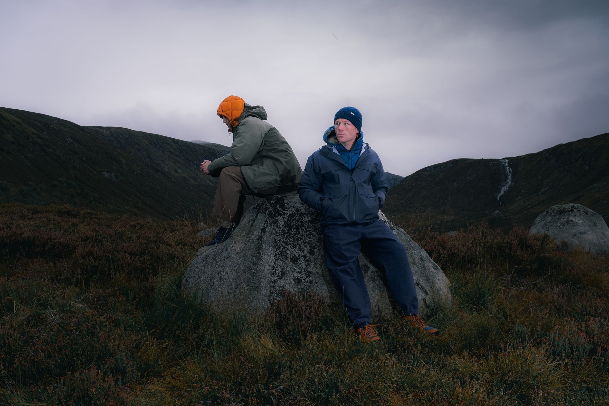 Two men hiking in Scotland wearing waterproof jackets by designer brand KESTIN