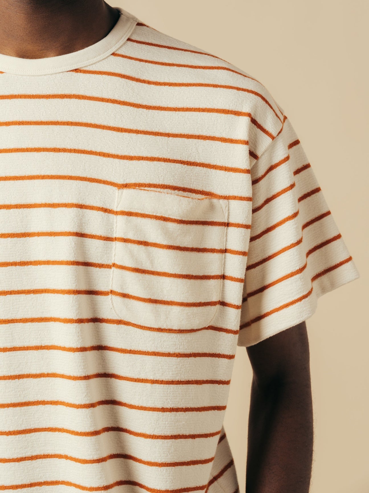 A man wearing a relaxed fit stripe tee from KESTIN.