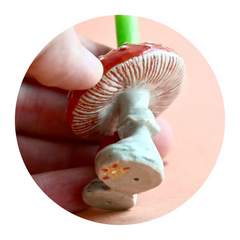 Mushroom Cake Topper, held  up to reveal the Camp Hollow Stamp on the stem