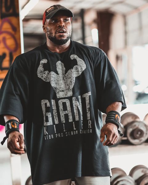 Bodybuilder wearing a pump cover (the GASP Iron Killer Tee)