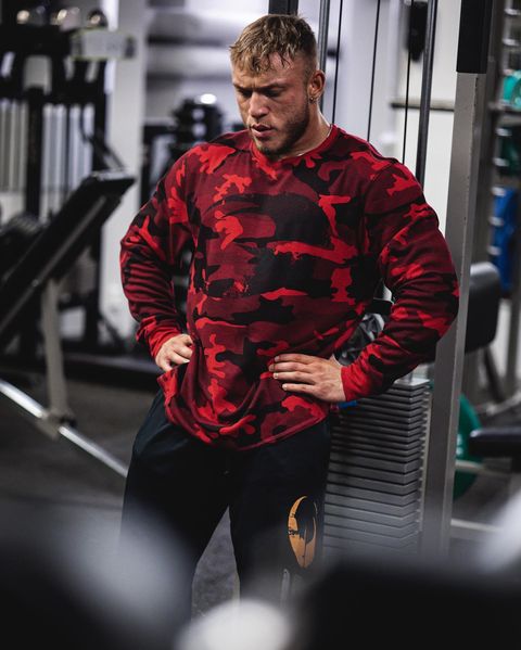 Bodybuilder wearing a GASP Thermal Logo Sweater gym pump cover