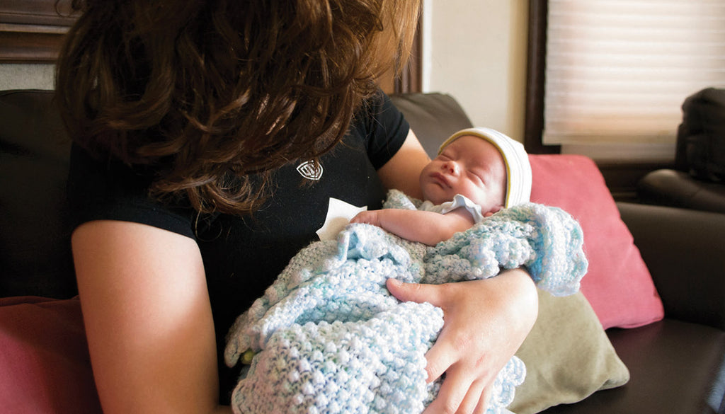 Mother holding her baby